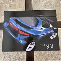 Front cover showing blue Ford concept car rendering with “visions 94” text