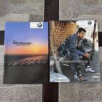 Both BMW 2004 catalogs side by side