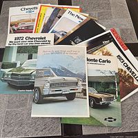 Stack of Chevrolet brochures fanned out