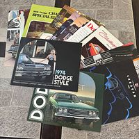 Group of all brochures fanned out on floor