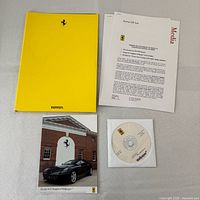 Complete press kit components laid out: folder, photo card, CD, press releases