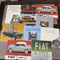 All 10 Fiat brochures laid out showing covers