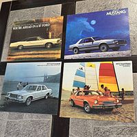 Four Ford brochures including 1967 Ford, blue Mustang, 1977 Granada, 1977 Pinto