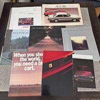 Eight brochures laid out showing covers and titles