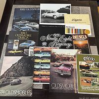 Group shot of all 11 brochures laid out