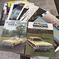 Stack of assorted Plymouth brochures showing variety and quantity