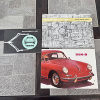 All three Porsche reproduction brochures laid out