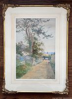 Full view of framed painting showing mat and ornate gilt frame