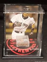 Front view of acrylic display case showing Ichiro photo backdrop, dirt cube, base graphics