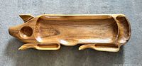 Full view of pig-shaped carved wood tray