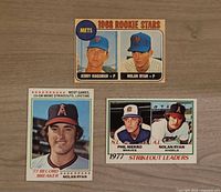 All three Nolan Ryan Topps baseball cards laid out on wood surface