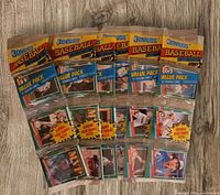 Six sealed 1991 Donruss Series 2 baseball card rack packs displayed on wood surface