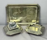 Front view of all three chrome Davidoff pieces upright against wall