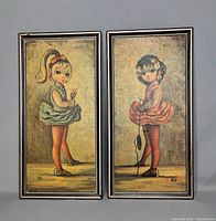 Both framed Maio prints side by side