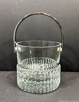 Front view showing full bucket with handle upright