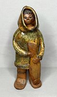 Full view of signed hand-painted terracotta Inuit sculpture