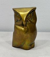 front view of brass owl figurine