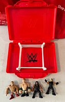 Ring open showing interior and four figures lined up