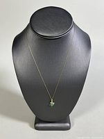 Full view of the 17-inch gold chain necklace displayed on a mannequin bust showing the pendant's size and chain length.
