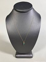 Full view of necklace displayed on bust form