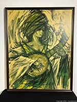 Full view of textured print showing a woman playing an instrument, bordered by a wood frame.