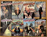 Eight Transmetropolitan trade paperbacks laid out in two rows, front covers visible