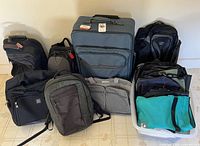 Group shot of all bags and bin of folded bags showing quantity and variety