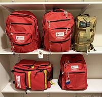 Front view of all five emergency bags on shelves