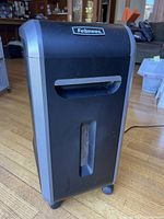 Front view of Fellowes 99Ci shredder showing viewing window and casters