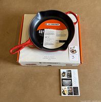 Skillet resting on original box with price tag visible
