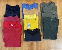 All 14 long-sleeve T-shirts laid out to show colors and quantity