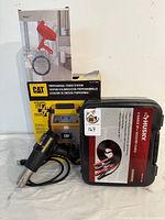 CAT professional power station box displayed with other items