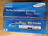 Retail box top showing Samsung DVD-V4600 branding and handwritten note