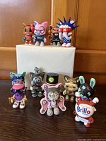 Group shot of all eleven vinyl figures front view