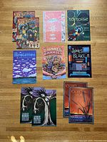 Full lot of 11 posters laid out on floor
