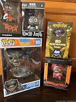 Group shot of all five boxed figures standing together