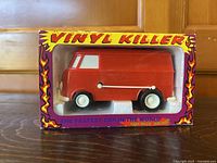 Front view of boxed red Vinyl Killer van record player