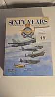 Front cover of the book 'Sixty Years - The RCAF and CF Air Command 1924-1984' with illustrations of various military aircraft and title.