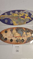 Two Canada millennium quarter coin sets from 1999 and 2000 in original oval-shaped packaging with a map of Canada design and 12 quarters each.