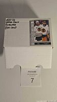 Closed white box labeled '2021-22 Upper Deck Extended (501-700)', containing hockey cards.