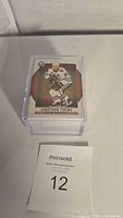 Top view showing card featuring Jonathan Toews in protective case