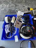 Complete set of WEN orbital car waxer and accessories in blue plastic case showing waxer unit, brushes, hose, and manuals.