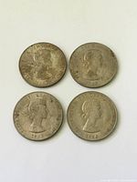 Obverse of four 1965 Churchill Dollars showing Queen Elizabeth II portrait and dates