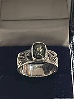 Front view showing stone and scrollwork band