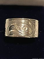 Front view of carved raven ring