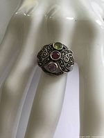 Round cluster ring with three coloured stones