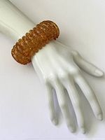 Bracelet on mannequin hand showing overall look and scale