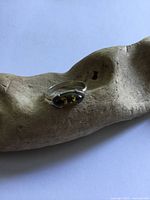 Top view of sterling silver ring with amber stone