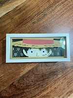 Front view of light box unlit showing Luffy paper cutout