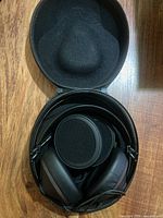 Headphones folded inside hard-shell case